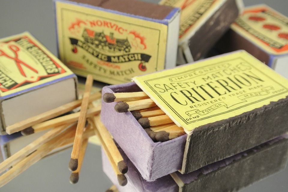 Picture of safety matches in matchboxes with old-fashioned labels.