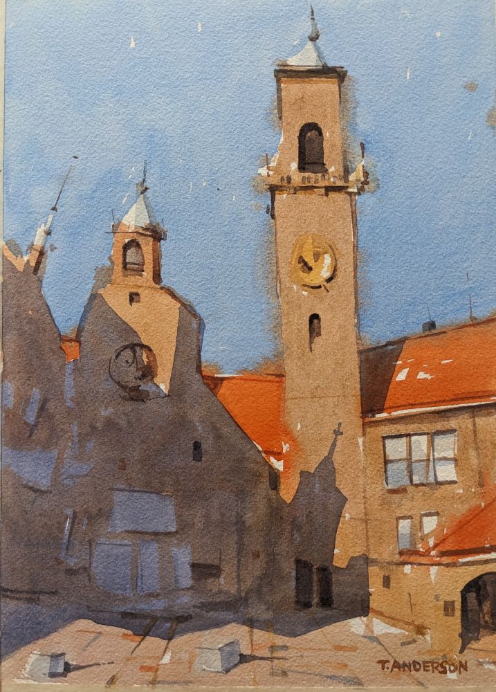 Lourdeskerk in Scheveningen, The Hague. A church with a tall, slender bell tower rises into a bright blue sky under sharp morning sunlight coming from the left. The tower extends vertically in the scene, framed by red-brown brick buildings with brilliant orange tile rooftops. A stark, purple shadow travels along the buildings from the right creating a silhouette of the small tower to the left on the entrance to the church, below the tower.