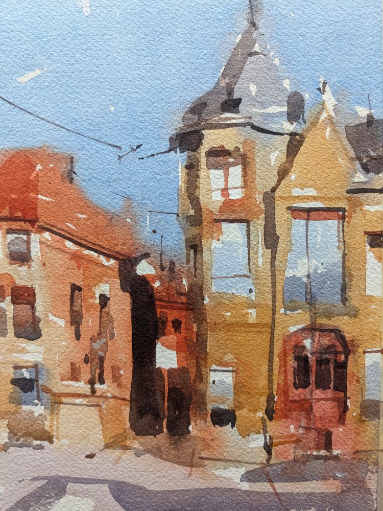 Watercolor painting of buildings along Prinsegracht in The Hague, Netherlands. A cloudless blue sky hangs above two buildings at a cross section along a wide street. The buildings are separated by an alley, darkened by the bright sunlight coming from the right. The three story building on the left has a red tiled roof and ochre facade. The building on the right is amassed in different levels and shapes, with a tall structure and pointed metal roof closer to the center of view. A large red door with darkened windows resides in the lower right, below large windows reflecting back the blue sky. In the foreground is a street with a blocky purple shadow running from right to left.