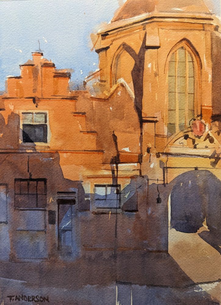Watercolor painting of Janskerk and archives entrance off Jansstraat in Haarlem, Netherlands. Sun drenches the bright, red brick church in the right with tall pointed arch windows reflecting back an opaque green-blue. An ornate arched entry way in ochre resides below, with dark, sharply angled shadows leading to the interior courtyard. To the left is a stepped gable facade with a darkened window on the second floor and several windows on the ground floor, draped in a dark purple shadow cast from a building behind the viewer. In the foreground are a sidewalk and street with indescript form.