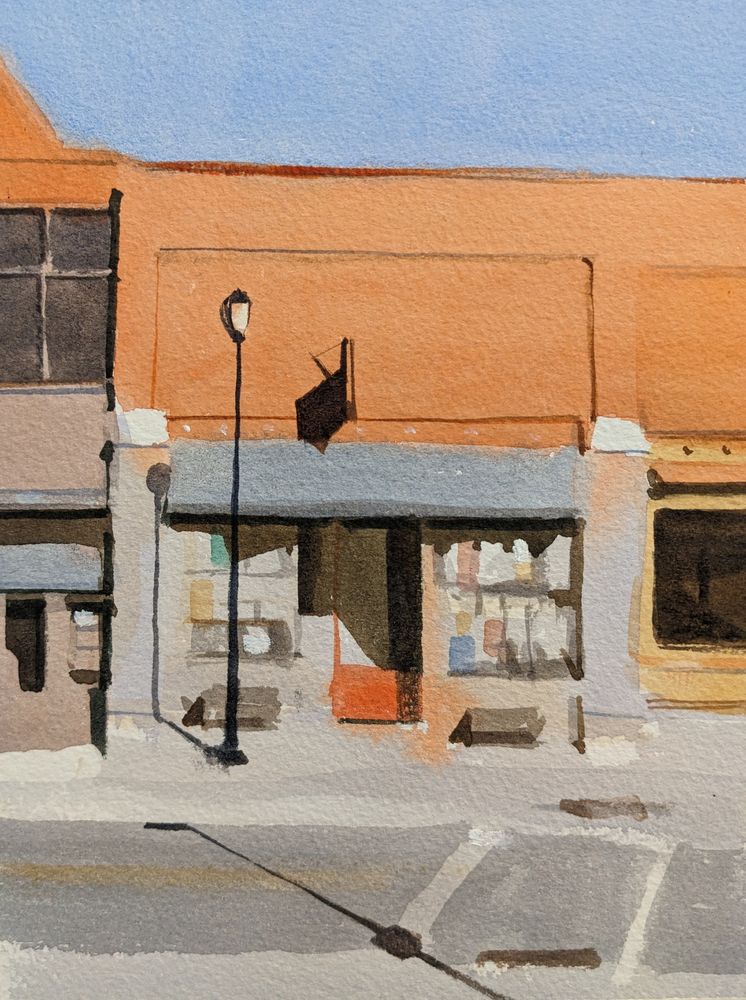 Watercolor painting of a storefront in Middlebury, Vermont.