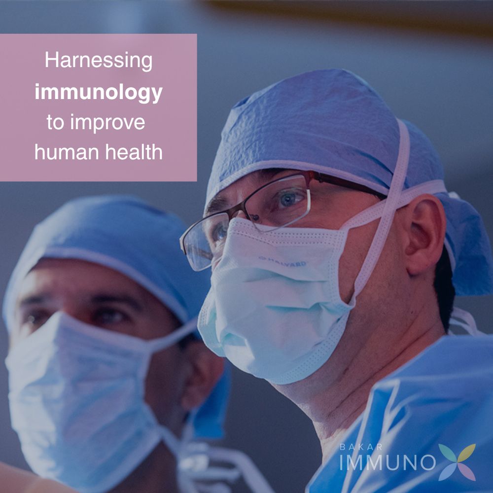 Group of physicians gathered and looking at a computer. There's a pink text box in the top left corner that reads: 'Harnessing immunology to improve human health'.