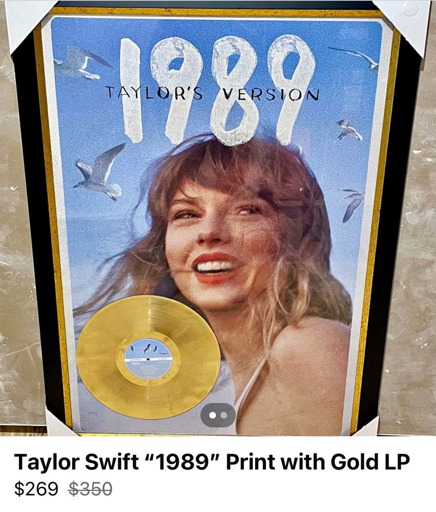 a facebook marketplace listing of a taylor swift 1989 print with a golden 1989 vinyl, all in a black and gold glass frame

price is $269