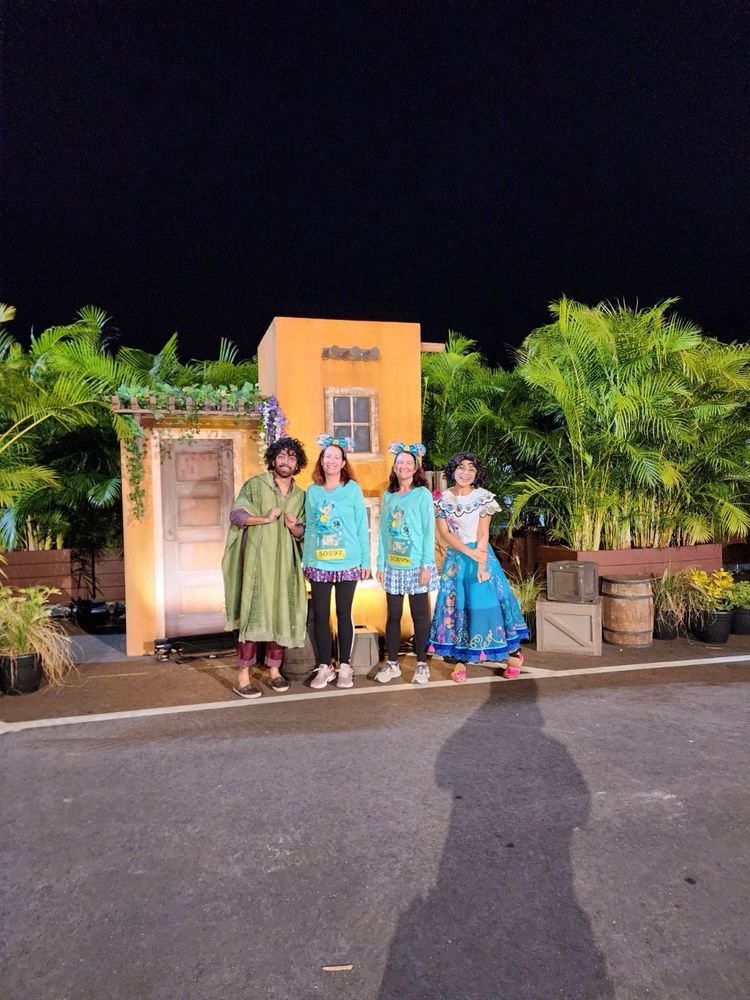 Four people dressed up for a race.