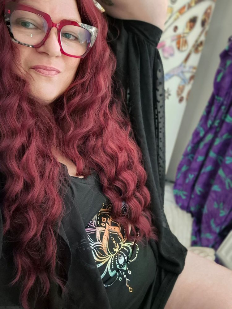 Fiery red locks cascading down female curvy body 