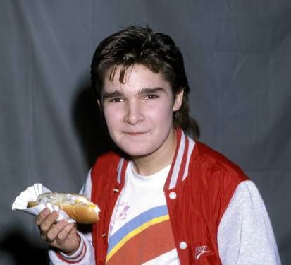 Corey Feldman holding a hot dog