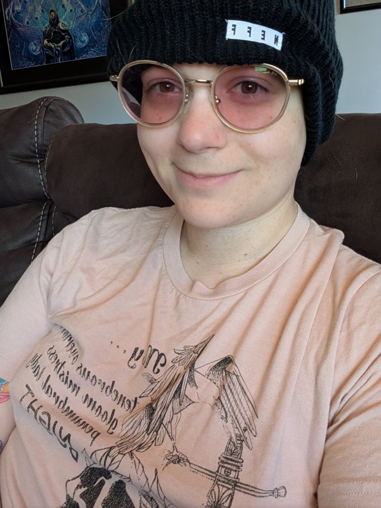 It's Biscuit in a pink top and black beanie!
