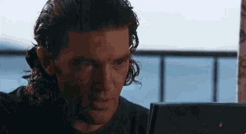 The gif of Antonio Banderas biting his fist in satisfaction