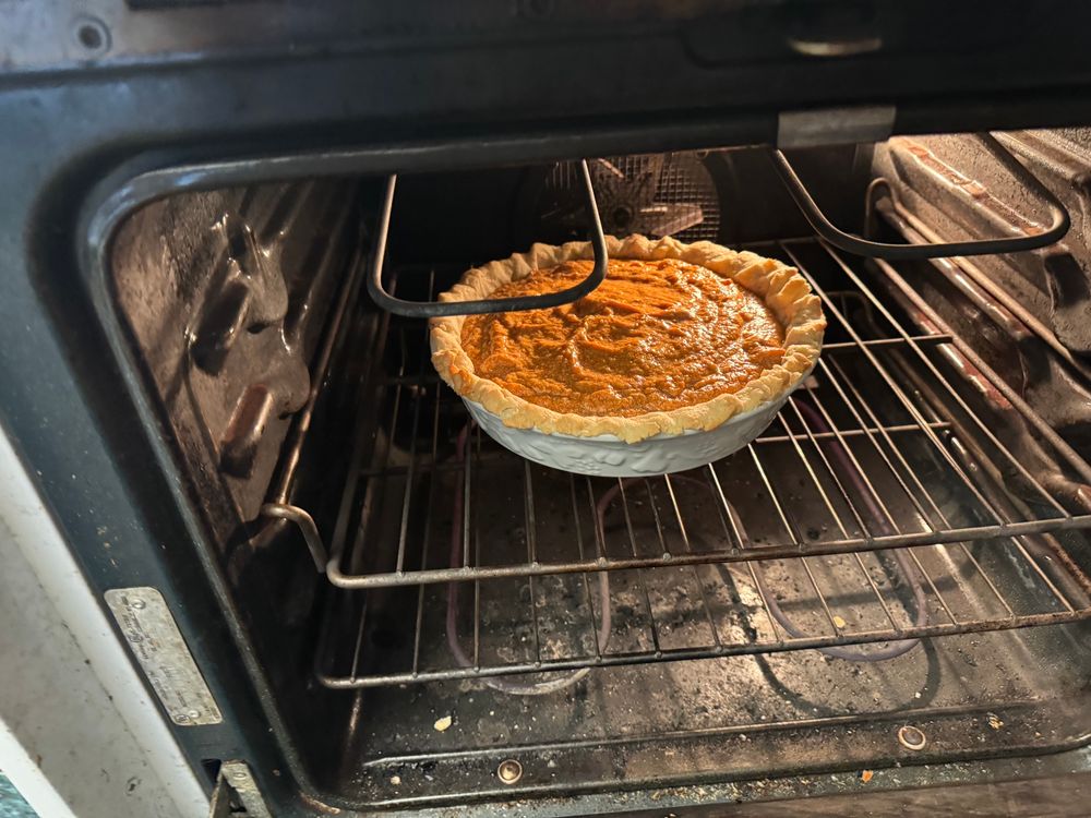 Into the oven a sweet potato pie goes. The consistency of the filling looks grainy, but it’s actually quite smooth and tastes great 