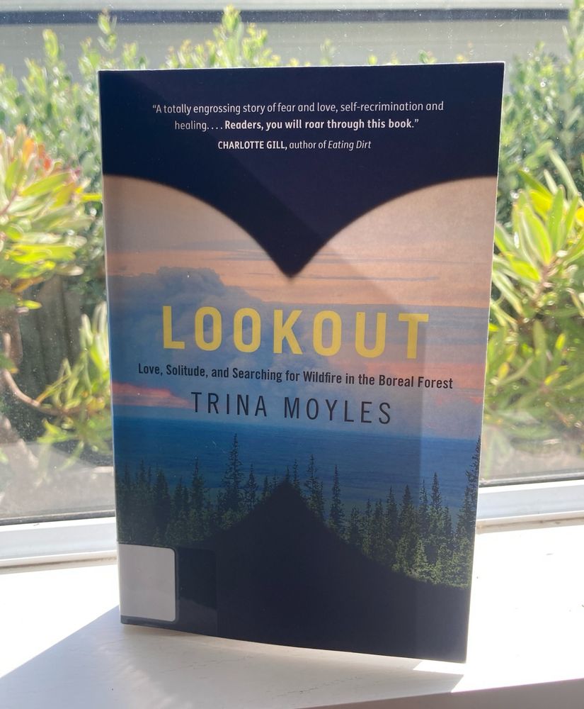 Paperback on a windowsill. “Lookout” by Trina Moyles. 