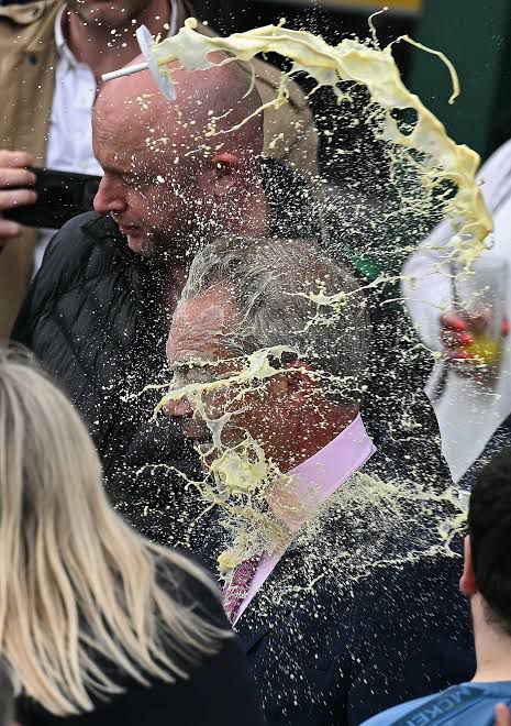 Nazi getting milkshaked. 