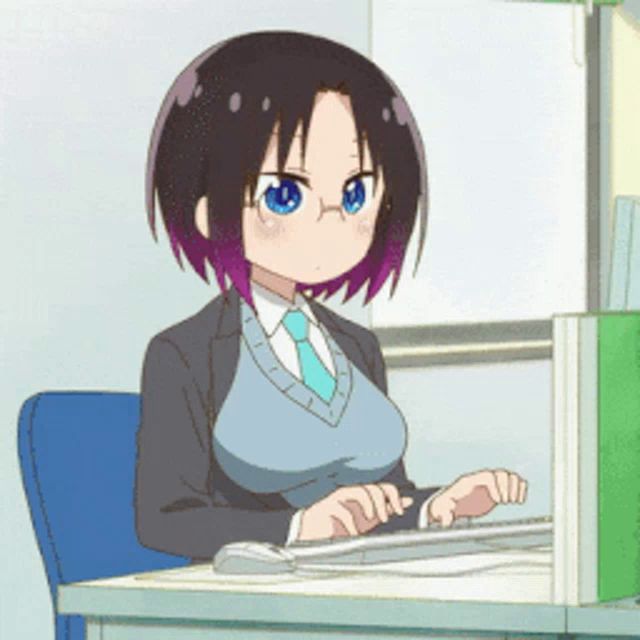 a cartoon girl is sitting at a desk typing on a keyboard