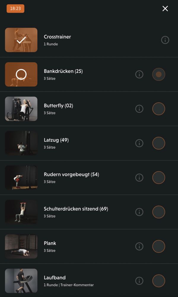 Beschreibung auf Deutsch:

Ein digitaler Trainingsplan wird auf einem Bildschirm angezeigt – vermutlich in einer Fitnessstudio-App. Die Anzeige zeigt eine Trainingsdauer von 18:23 Minuten, was auf die bisher verstrichene Zeit des aktuellen Trainings hinweist. Aufgelistet sind mehrere Übungen wie #Crosstrainer, #Bankdrücken, #Butterfly, #Latzug, #Rudern vorgebeugt, #Schulterdrücken sitzend, #Plank und #Laufband. Die erste Übung, der Crosstrainer, ist bereits abgeschlossen (erkennbar am Häkchen). Alle anderen Übungen sind noch offen, jeweils mit „3 Sätze“ versehen. Der dunkle Hintergrund verleiht der Darstellung eine ruhige, fast nächtliche Atmosphäre – passend zur Idee von Sport bei Nacht.

⸻

Description in English:

A digital workout plan is shown on a screen—likely from a gym app. The time display shows 18:23 minutes, indicating the duration of the current training session so far. The routine includes several exercises: #Crosstrainer, #BenchPress, #Butterfly, #LatPulldown, #BentOverRow, #SeatedShoulderPress, #Plank, and #Treadmill. The first activity, the crosstrainer, is already completed (marked with a check). All other exercises are still pending, each listed with “3 sets.” The dark background adds a calm, almost night-time mood—fitting the idea of working out at night.