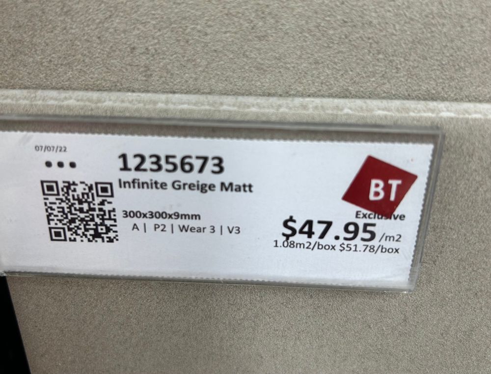 A label of a floor tile called ‘infinite greige Matt’