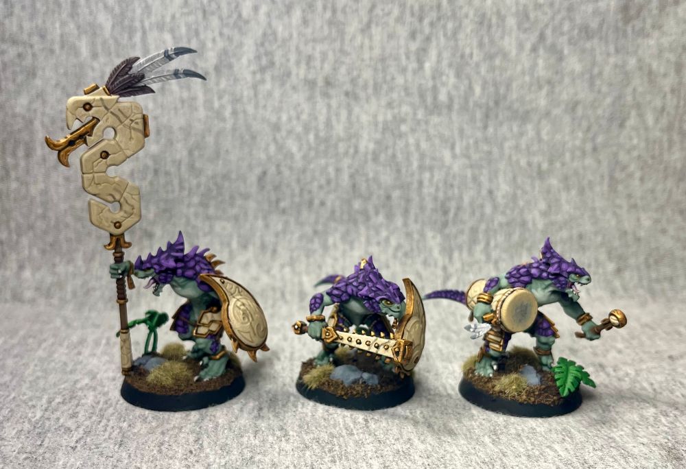 Painted Lizardman miniatures.