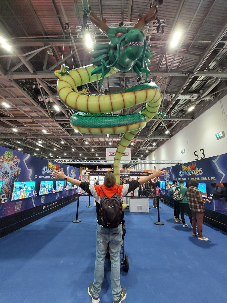 A dork standing in front of the Eternal Dragon Shenron at London MCM.