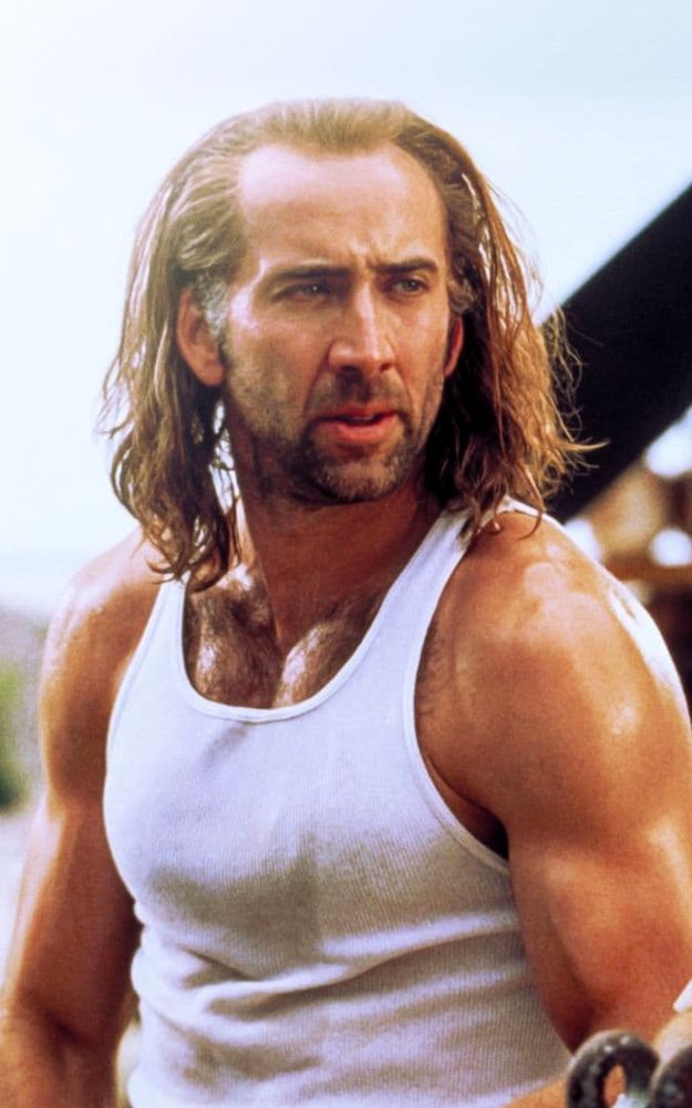 A ripped, sweaty Nicolas Cage in Con Air. He rocks Jesus hair and wears a white tank top. The sun glistens off his toasted skin.