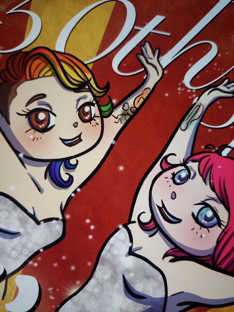 Close up of new episode art for the podcast Roll History, two chibi girls, one with rainbow hair and brown eyes, the other with pink hair and blue eyes doing the 'ta-da' pose with their arms outstretched on a red and gold background with lots of sparkles