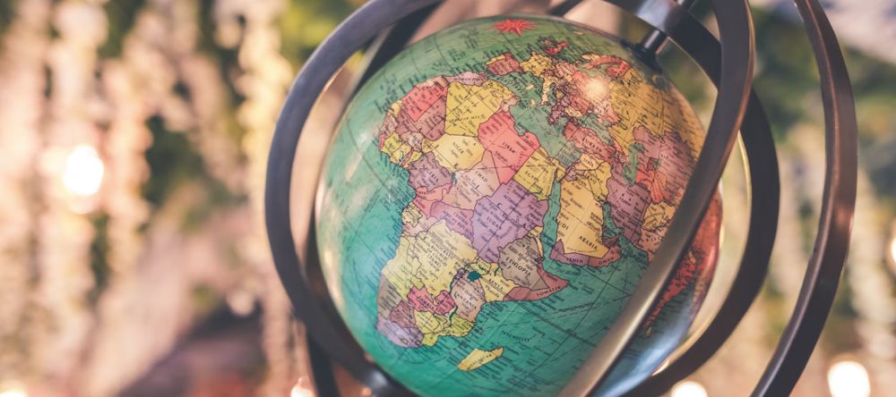 A globe of earth tilted to one side with Africa prominent