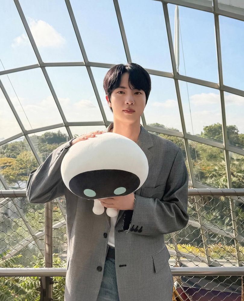 Wootteo held by Seokjin at the Cloud Forest