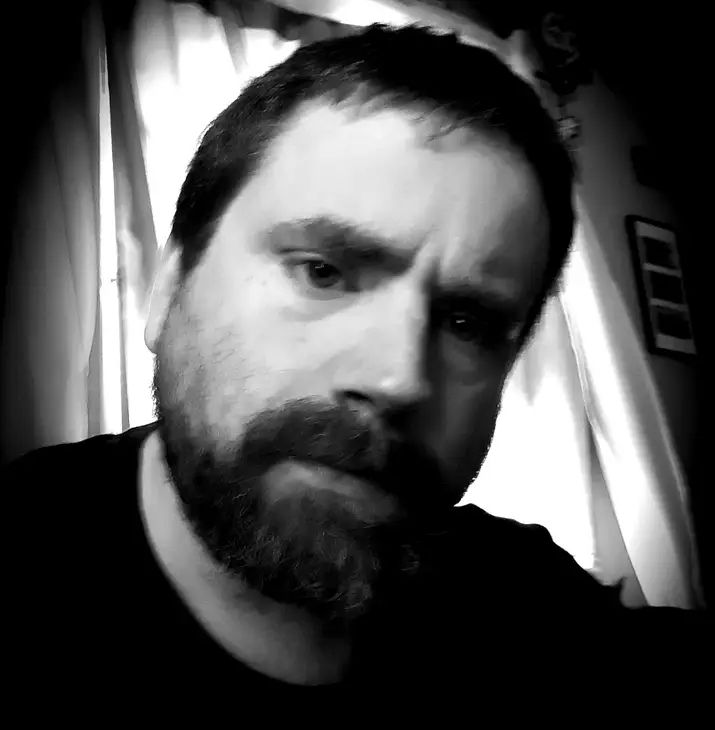 Me in B&W, realizing there's some cat vomit across the room I gotta clean up now