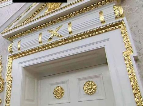 detail from above photo, showing the doorway to the Oval Office festooned with decadent gold leaf 