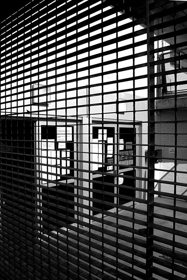 School entrance with iron grill.