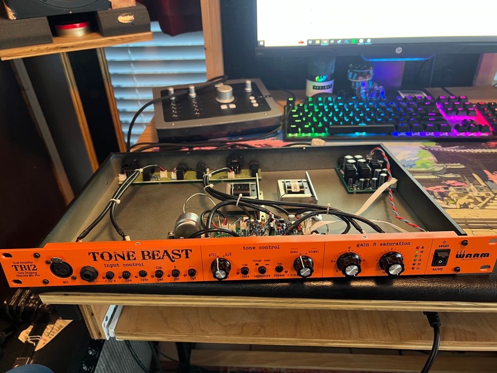 front view of the TB12 Tone Beast, Orange Rev. Warm Audio released a “Black” version in 2019. from what i’ve seen, aside from shifted transformer positions and the obvious faceplate color change, there doesn’t appear to be much of a difference between the two.