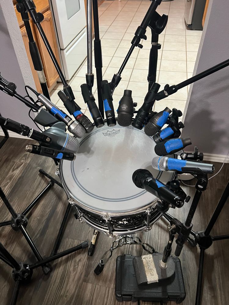 a snare drum, surrounded by microphones of all shapes and sizes nearly all the way around. 

the plan was to shoot them all out at once, but i’m realizing now that:

1.) i’m out of mic stands; 
2.) some of these mics will clip in an unpleasant way and/or not really be useful on this application;
3.) this is verging on ridiculous and unusable as it is already;
4.) there are already issues with setup that will make this not-very-scientific.

i’ll reapproach with something more useful soon.