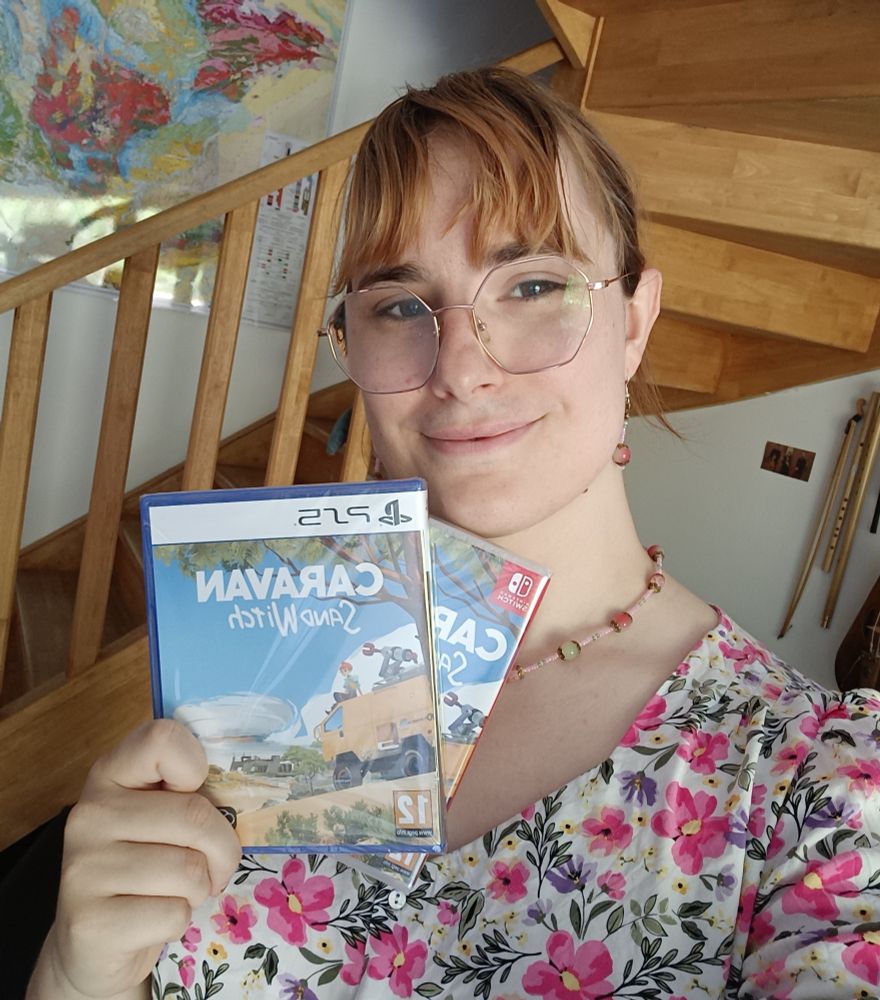 Selfie of me holding the box of caravan SandWitch switch and ps5 edition 