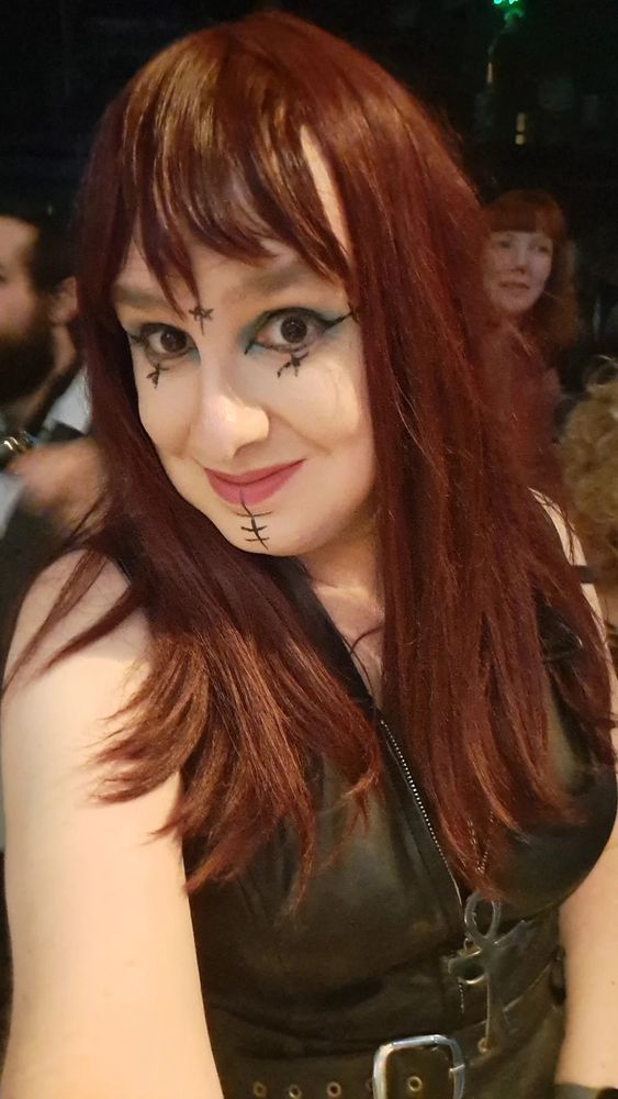 Red haired goth woman (me)