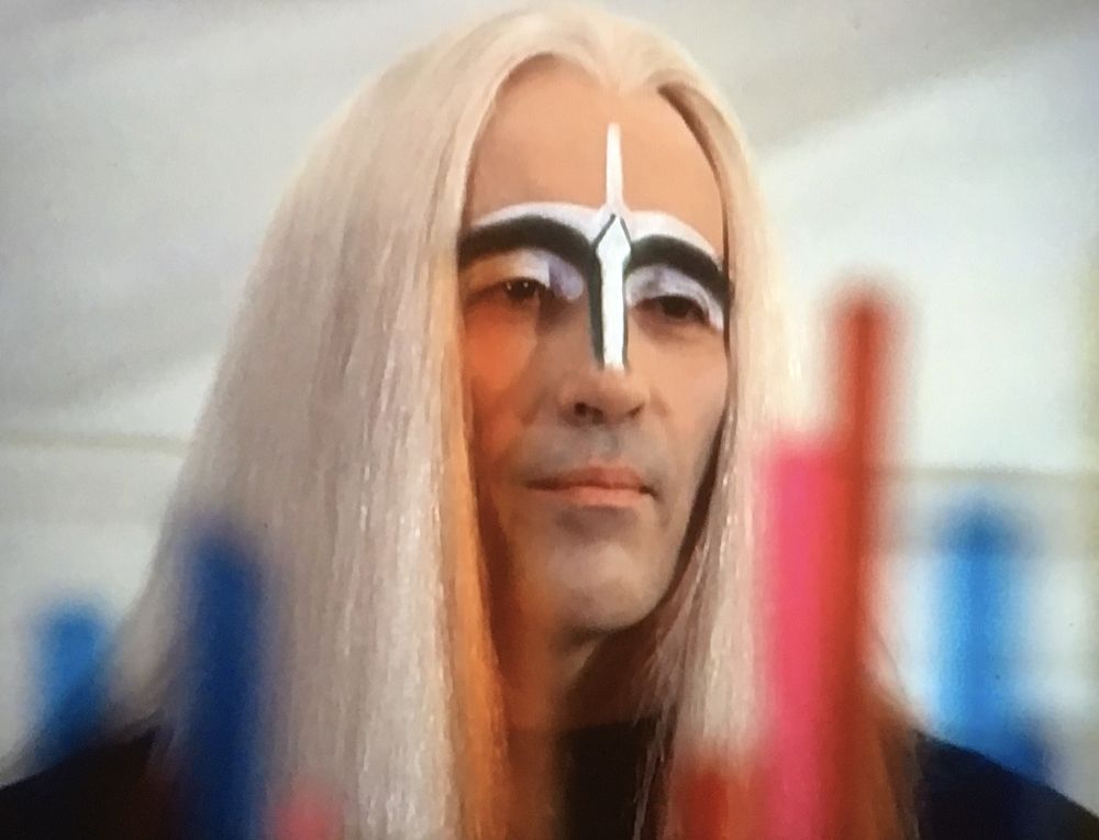 Christopher Lee plays an alien in Space:1999 with an Elf wig ad silly make up.