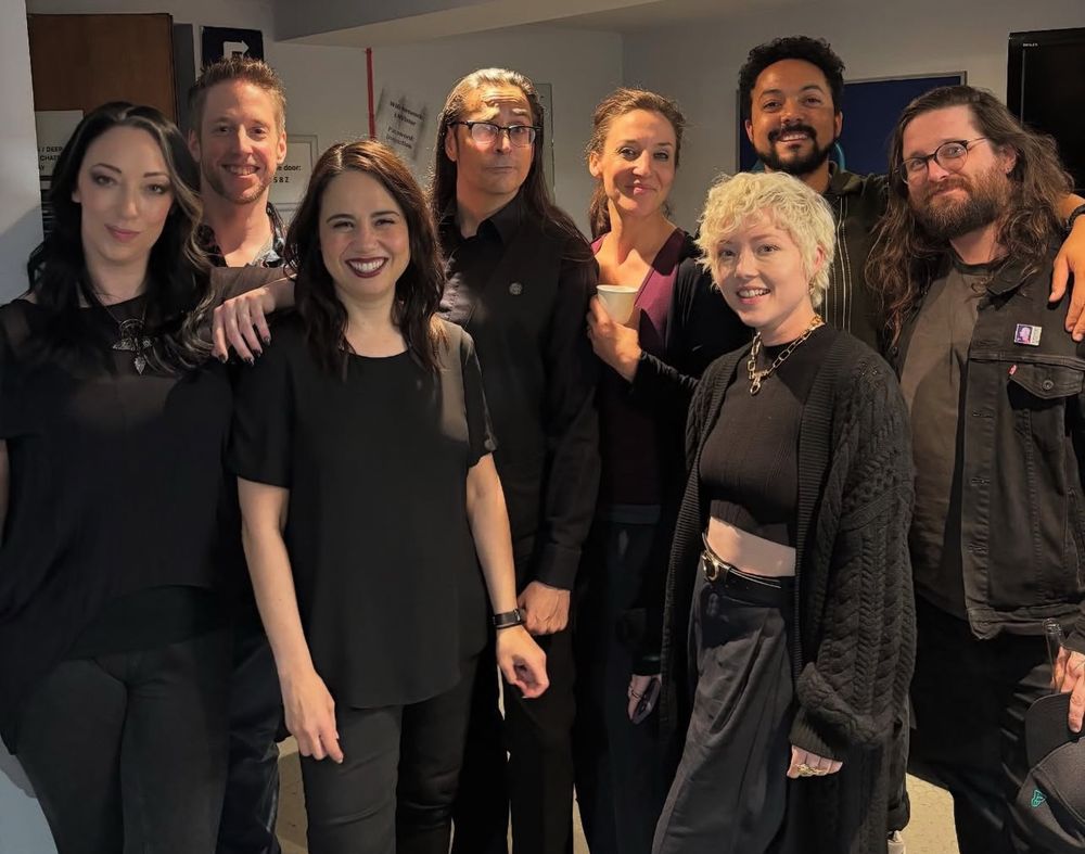 A group shot backstage of the Call of Cthulhu cast (Samantha Béart, Mark Meer, Belinda Cornish, Jasper William Cartwright, Johnny Chiodini, and Josephine McAdam) with visitors Amelia Tyler and Jay Britton.