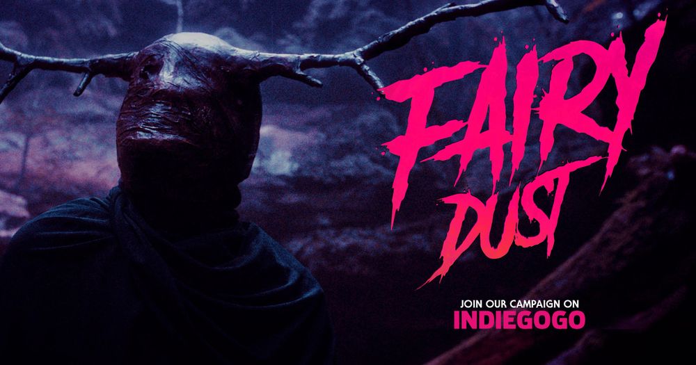 A dark blue toned graphic with a masked figure on the left. The mask is featureless with antlers extending from it. On the right in grungy graphic hot pink letters reads “FAIRY DUST” with smaller text beneath reading “join our campaign on INDIEGOGO”
