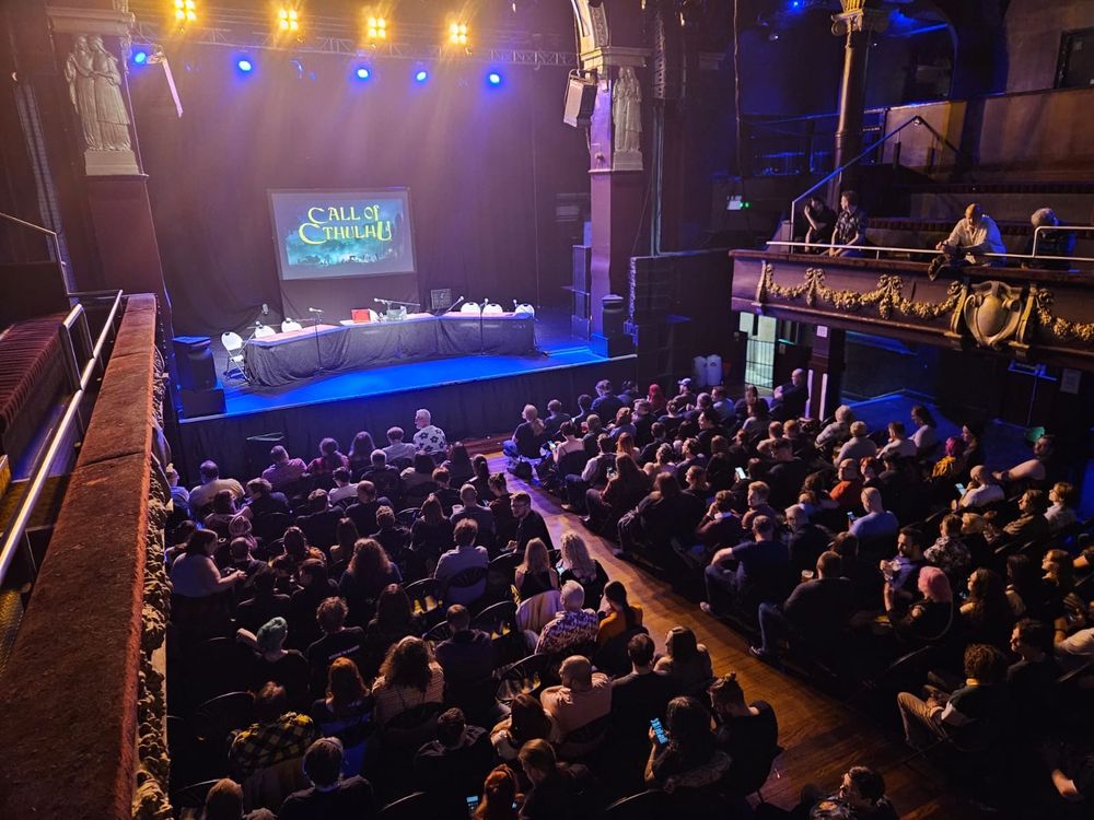 Photo of the crowd in the audience facing the stage for Call of Cthulhu live.