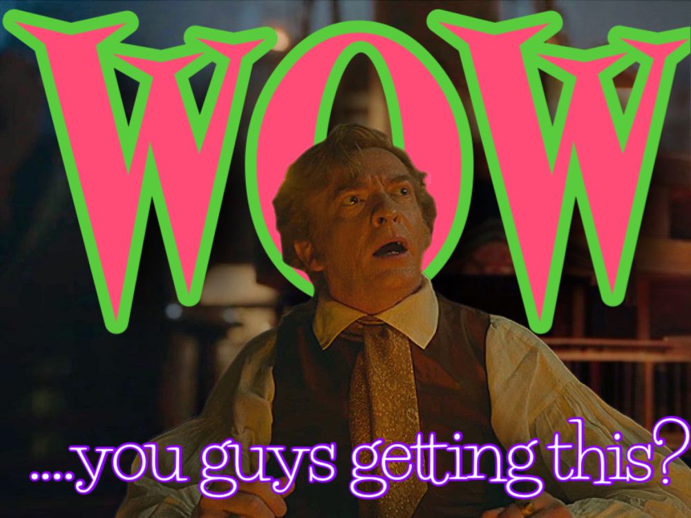 screenshot from ofmd s1e2 "A Damned Man" showing Stede Bonnet (Rhys Darby) on the deck of the Revenge warmly lit by lantern light. Text has been added to the image: "WOW" on the top in all capitals with a bright pink text outlined in bright green, and "...you guys getting this?" in a jaunty lowercase white text outlined in bright purple.