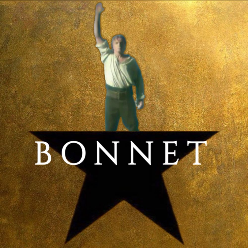 the logo from the musical Hamilton, but make it Stede Bonnet. A black star on a burnished gold background, but in place of the 5th / topmost point of the star, there's a cutout image of Stede raising his right arm like a lighthouse as he rows up to talent show island from the final shot of ofmd season 1 / s1e10 "Wherever You Go, There You Are." Overlaid across the black star is the last name "BONNET" written in a narrow white all-caps font with serifs.