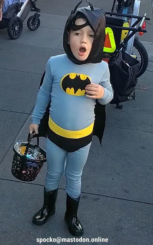 Child in a Batman costume n Yawning Batman in San Francisco Halloween 2025