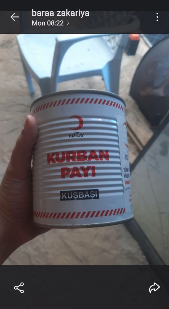 Canned meat, with the words "Kurban payi" writen in red letters on white background 