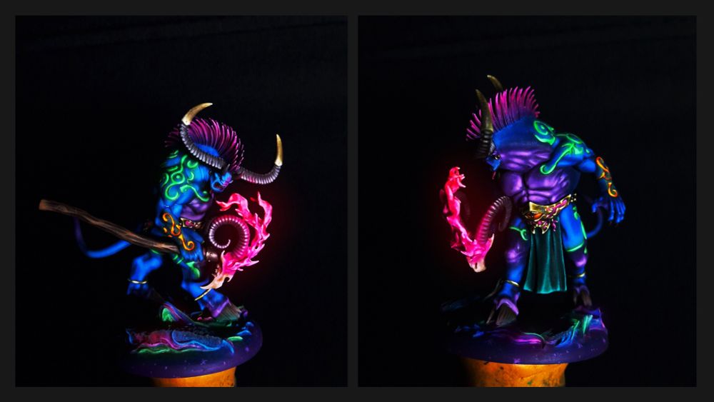 Painted Ogroid Thaumaturge. Blue skin, pink hair, green and orange runes, pink fire, purple belly, quite colourful