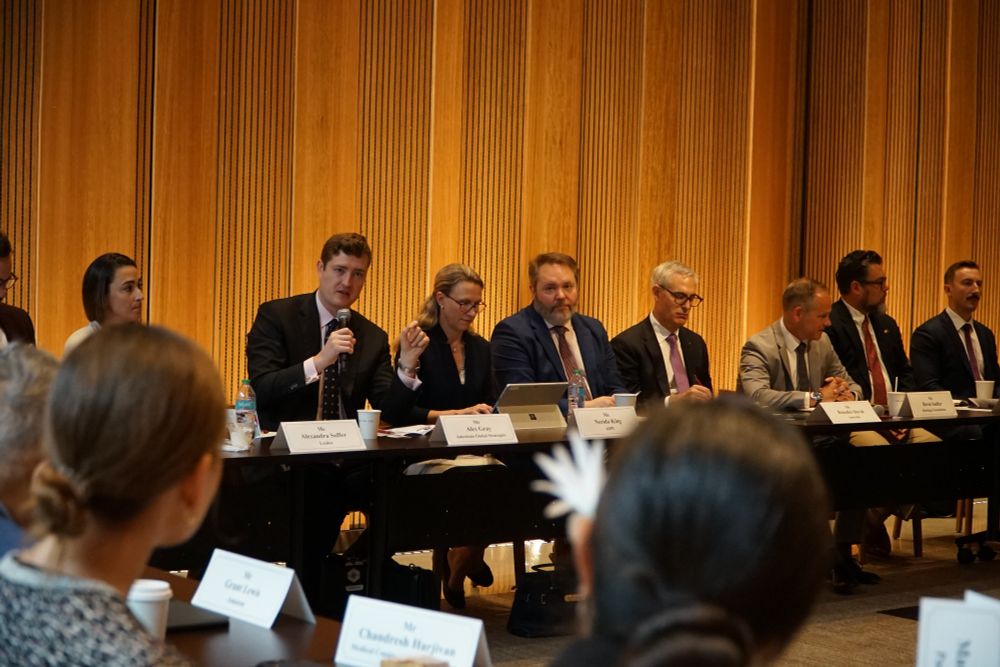 A panel of speakers addresses participants at the Pacific roundtable event.