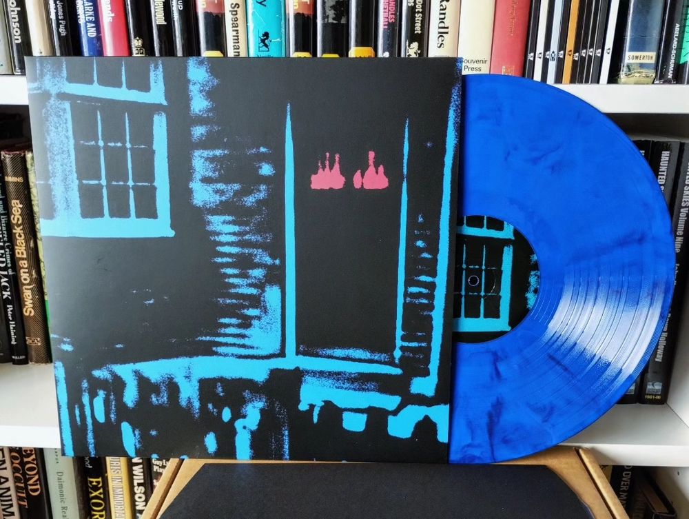 This House Is Haunted record sleeve and blue vinyl record.