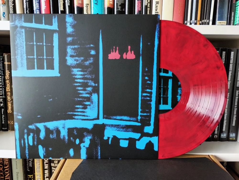 This House Is Haunted record sleeve and red vinyl record.