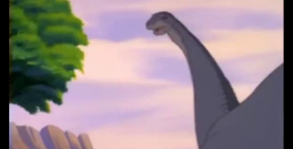 a cartoon of a dinosaur with a long neck standing next to a tree .