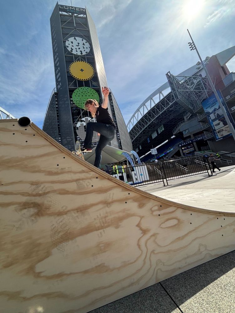 Myself skating a half pipe in front of the tower thing at the stadium.