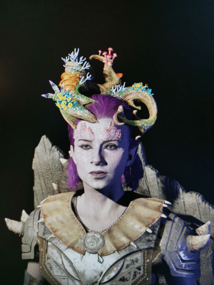 An image of a pink haired video game character with a strong jaw an wooden horns