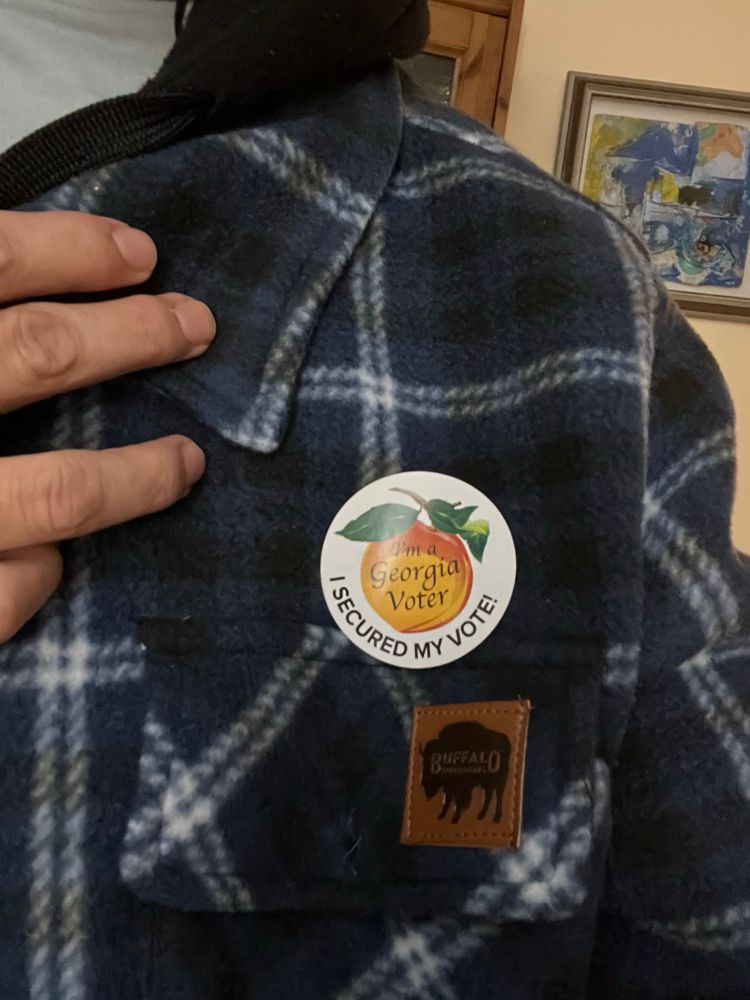Sticker on lapel that reads, I am a Georgia Voter, I secured my vote!