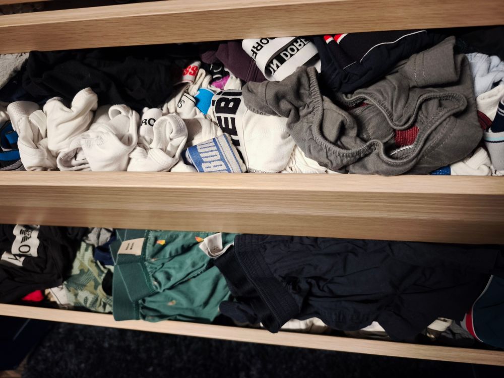 A picture of drawers overflowing with underwear 