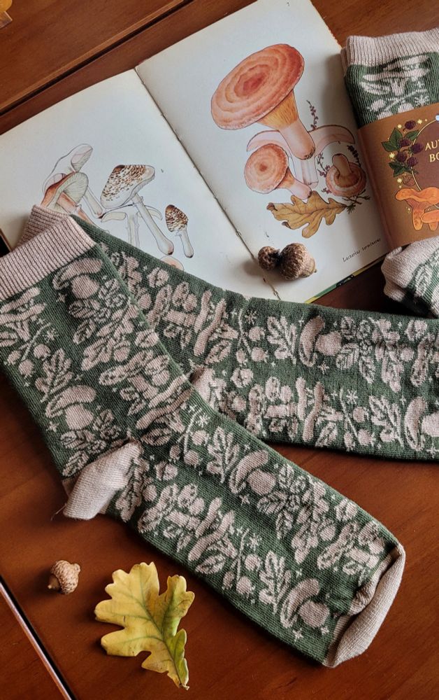 green autumnal socks on a wooden desk