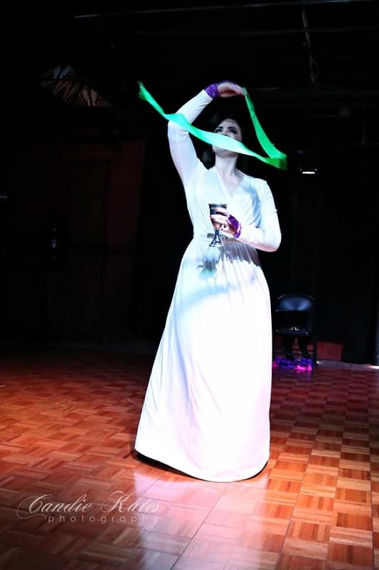 Magic Miss Elle performing as Planeswalker and goddess of death, Liliana Vess in a white dress- inspired by her origins card Dark Dabbling at Carnivale Debauche’s first ever, Nerdlesque show in 2019. 
Photo by Candie Kates Photography.
